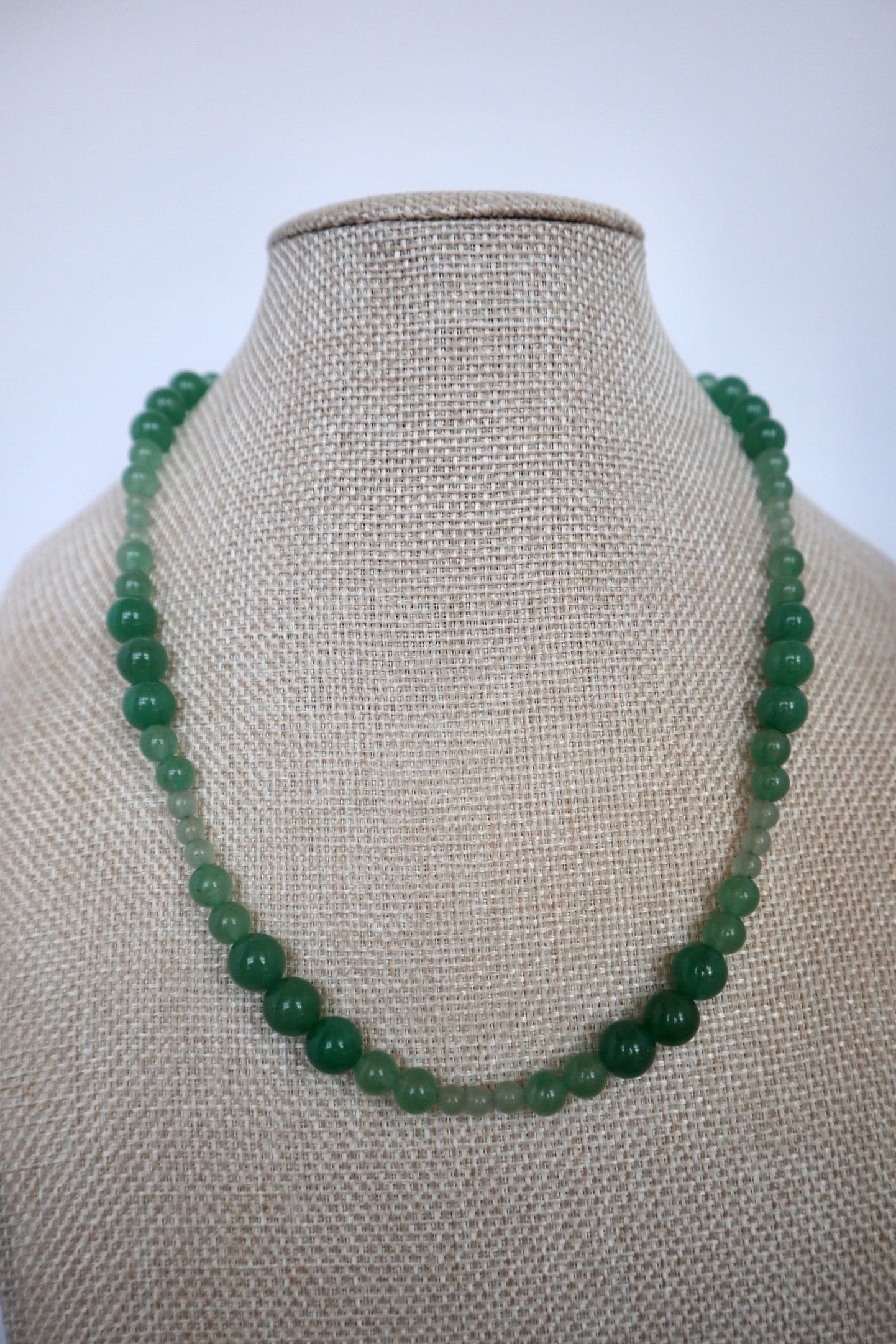 Auréad Designs Aventine green aventurine beaded necklace displayed on a linen bust form, front view showing full 18-inch length.