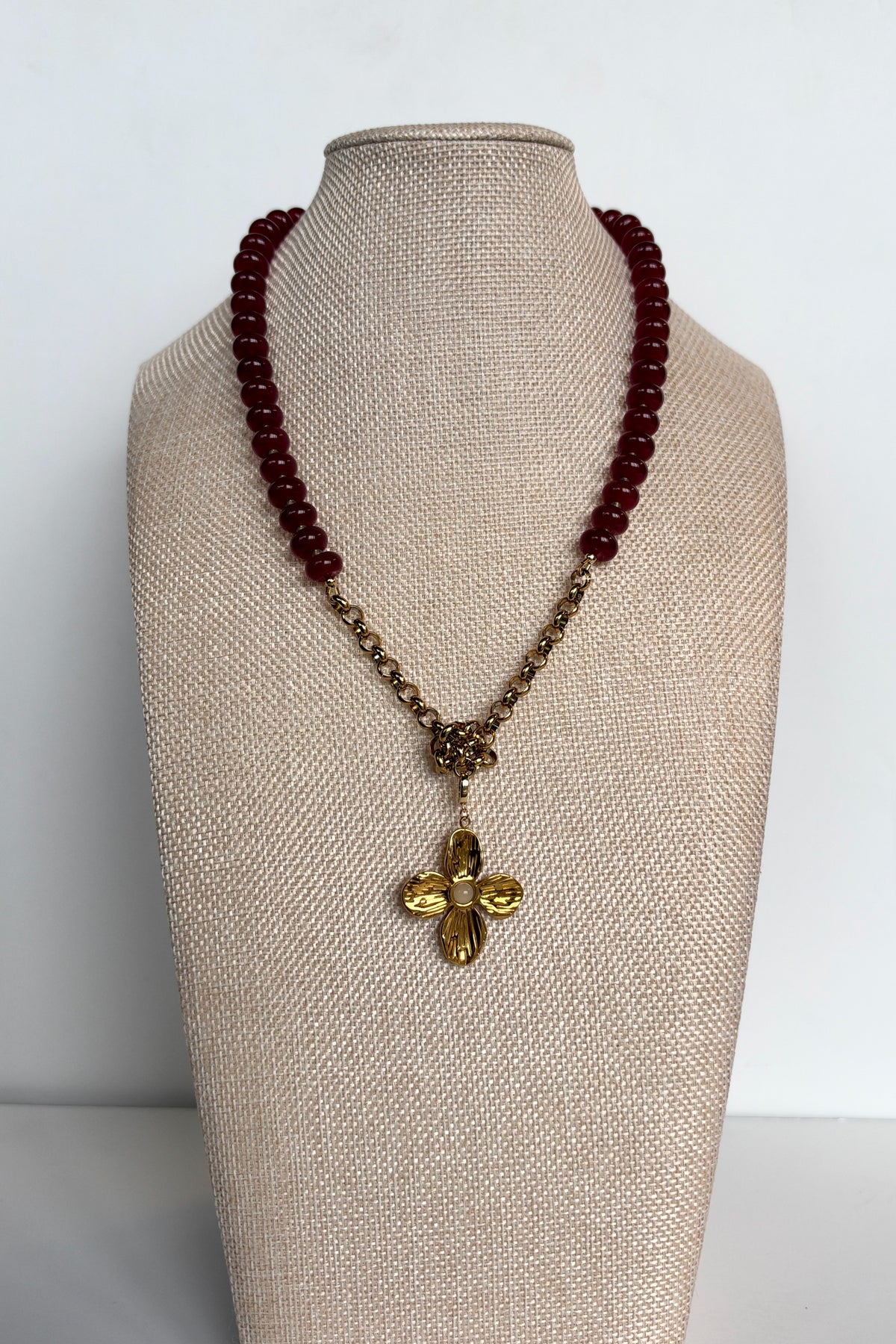 Carmina red jade necklace with removable flower pendant by Auréad Designs displayed on linen bust form