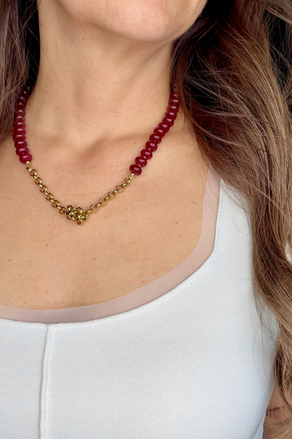 Carmina red jade necklace by Auréad Designs, worn without pendant showing knotted gold rolo chain