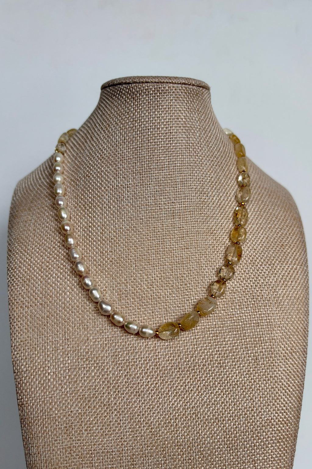 Dawn citrine and freshwater pearl necklace by Auréad Designs displayed on linen bust form, full front view