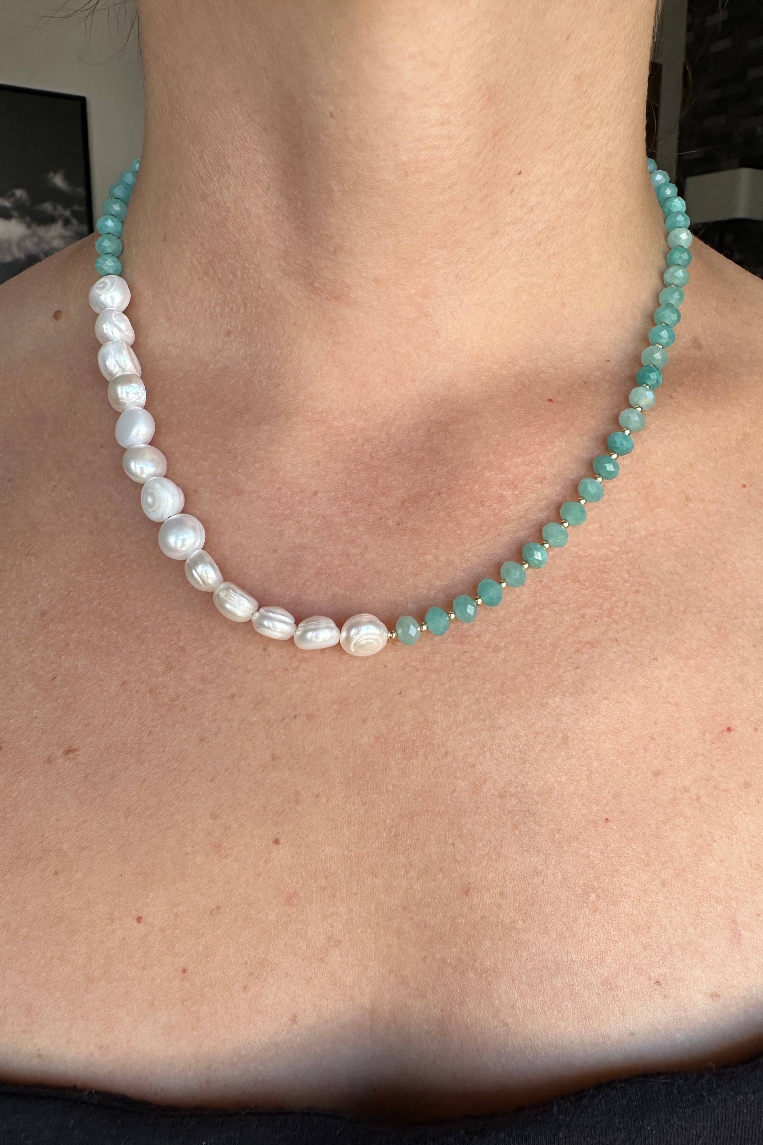 Lake necklace by Auréad Designs worn at the neck over a black tank top, handmade amazonite and freshwater pearl strand from the Glacier Collection