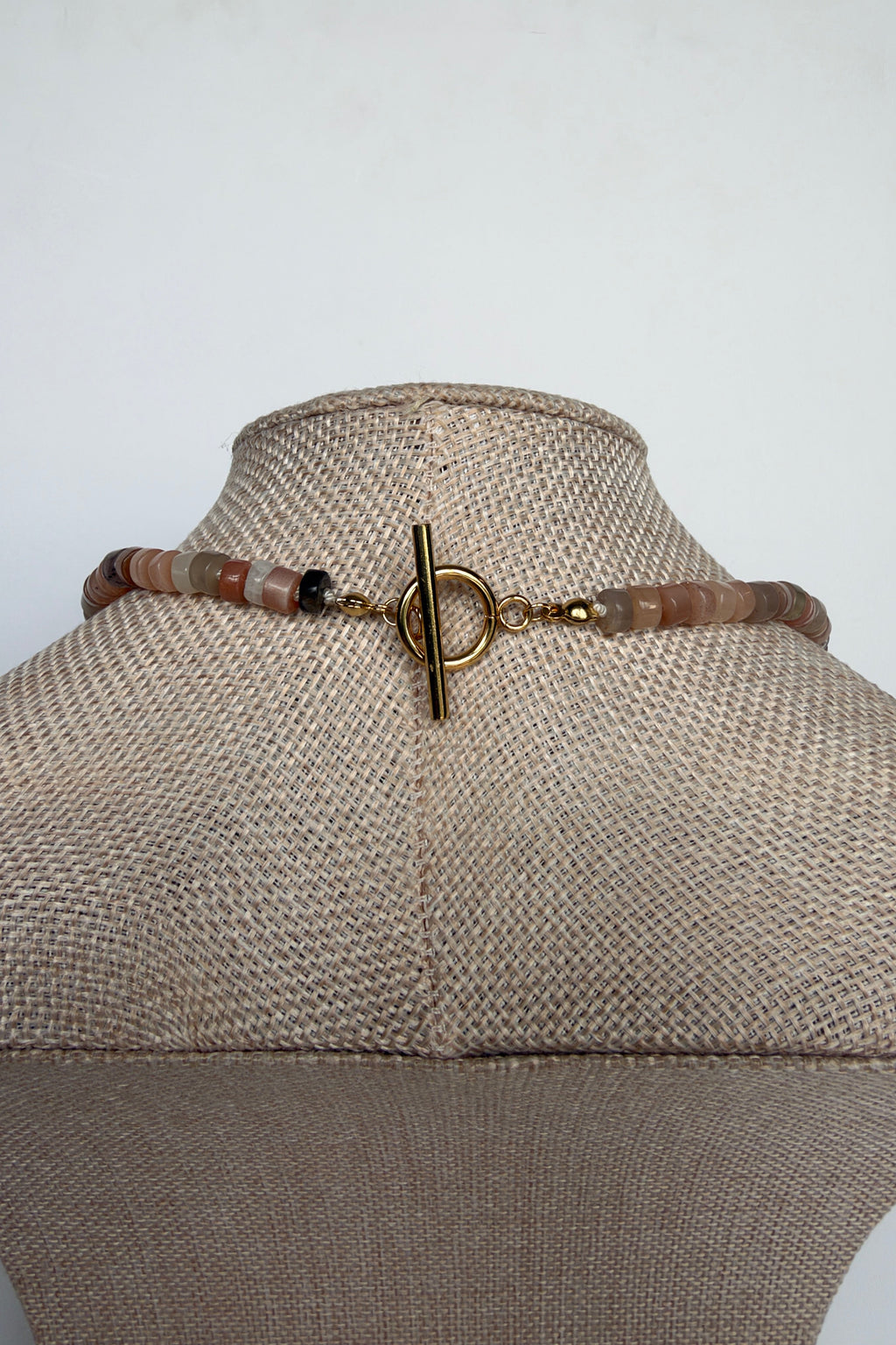 Maeven moonstone heishi necklace by Auréad Designs gold toggle clasp detail on bust form
