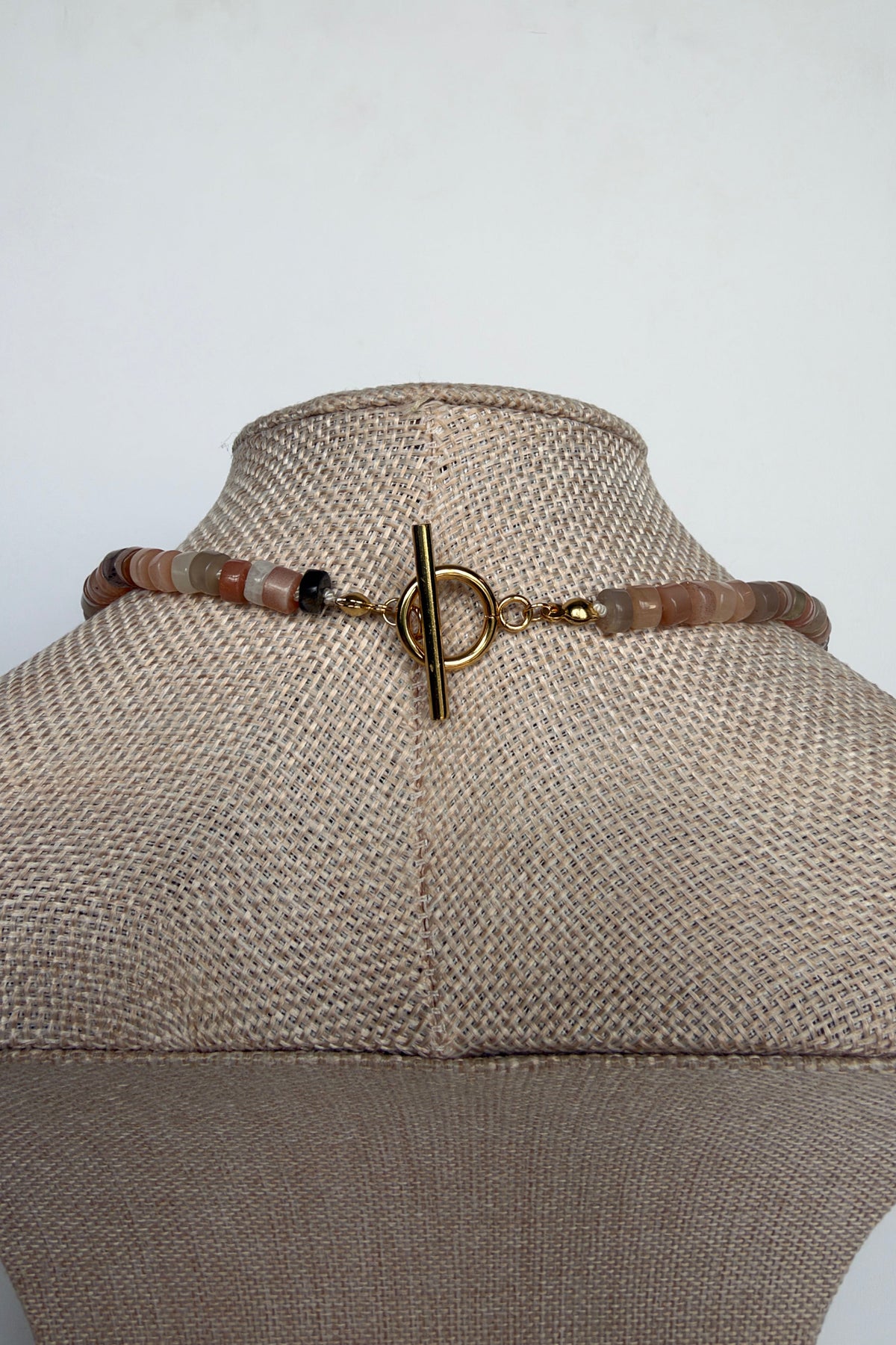 Maeven moonstone heishi necklace by Auréad Designs gold toggle clasp detail on bust form