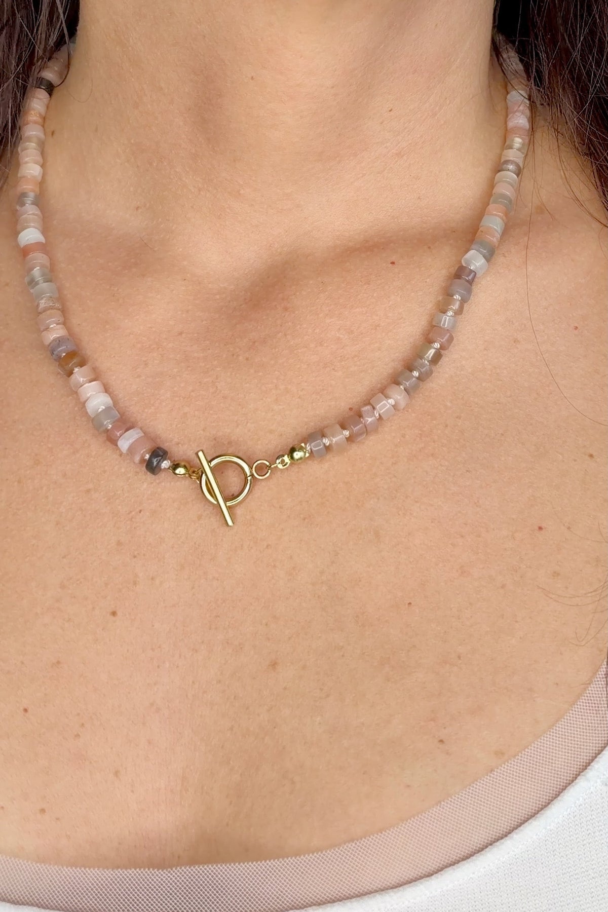 Maeven moonstone heishi necklace by Auréad Designs worn with gold toggle clasp at front
