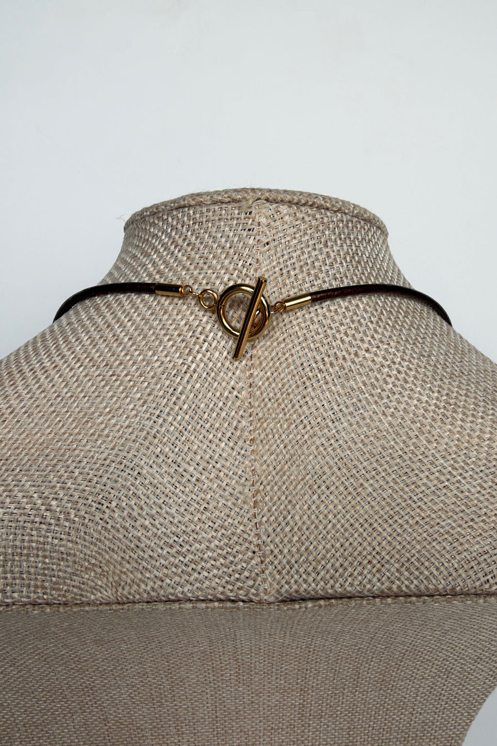 Rosenne rose quartz pendant necklace by Auréad Designs, back view showing gold toggle clasp on bronze leather cord