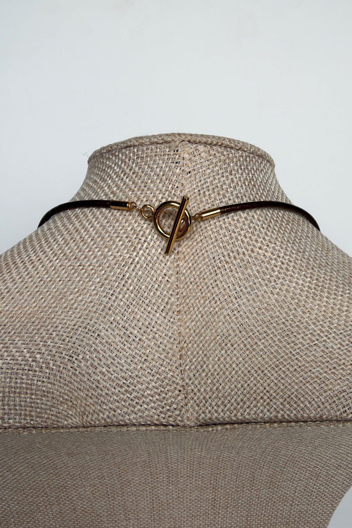 Rosenne rose quartz pendant necklace by Auréad Designs, back view showing gold toggle clasp on bronze leather cord