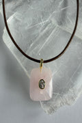 Rosenne rose quartz faceted pendant necklace by Auréad Designs, close-up showing CZ center stone and gold bail