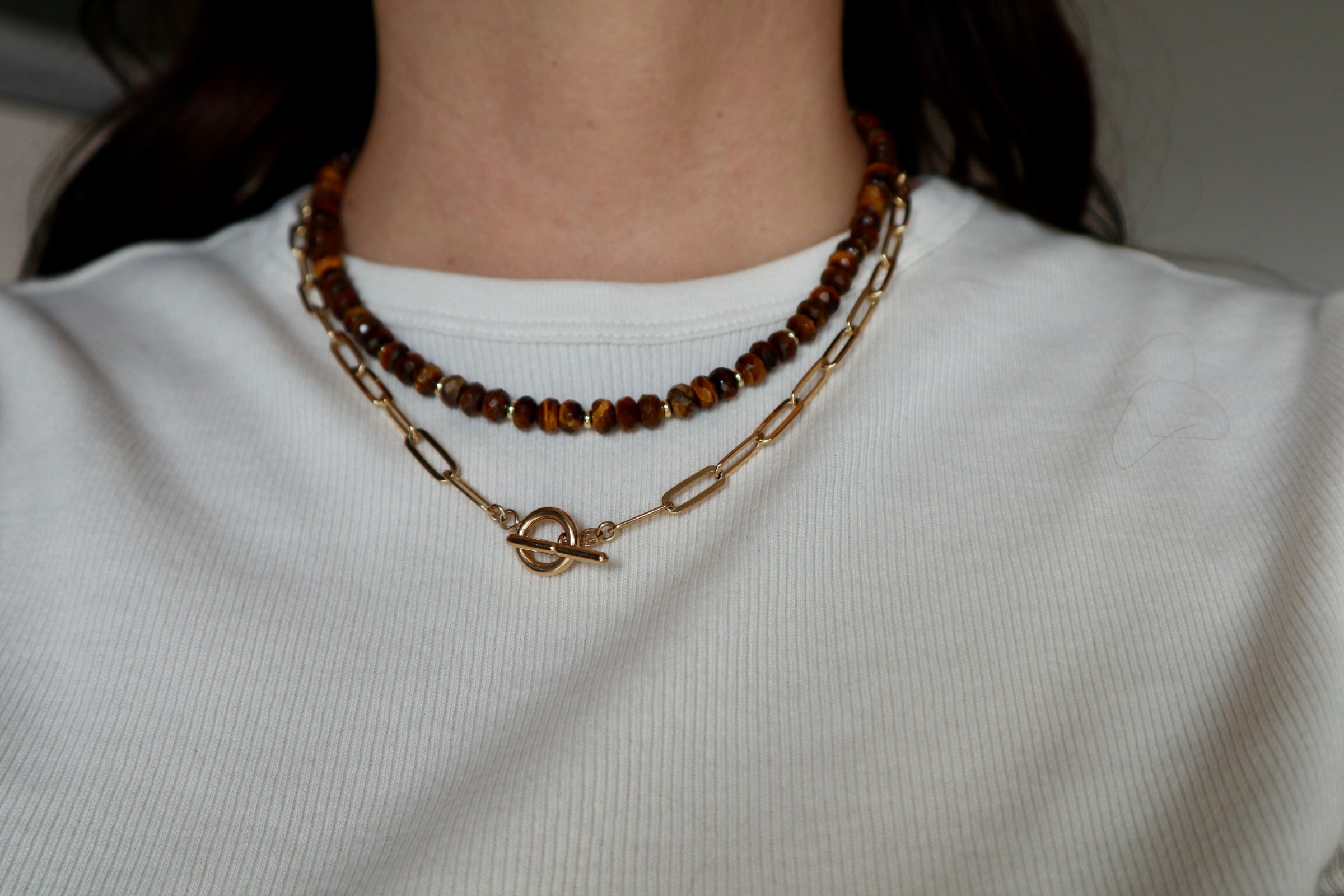 Sable necklace by Auréad Designs worn on model, showcasing the depth and warm tones of the tiger eye beads and gold-filled accents