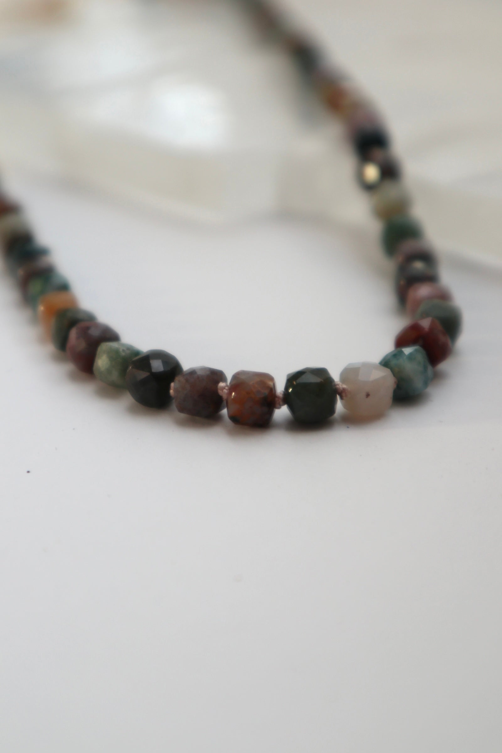 Detail shot of the Siena necklace highlighting the silk knots between beads and the Indian agate beads 