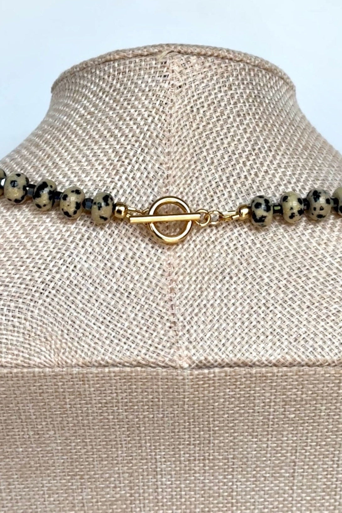 Tessere Dalmatian jasper and hematite necklace by Auréad Designs, detail view of gold toggle clasp