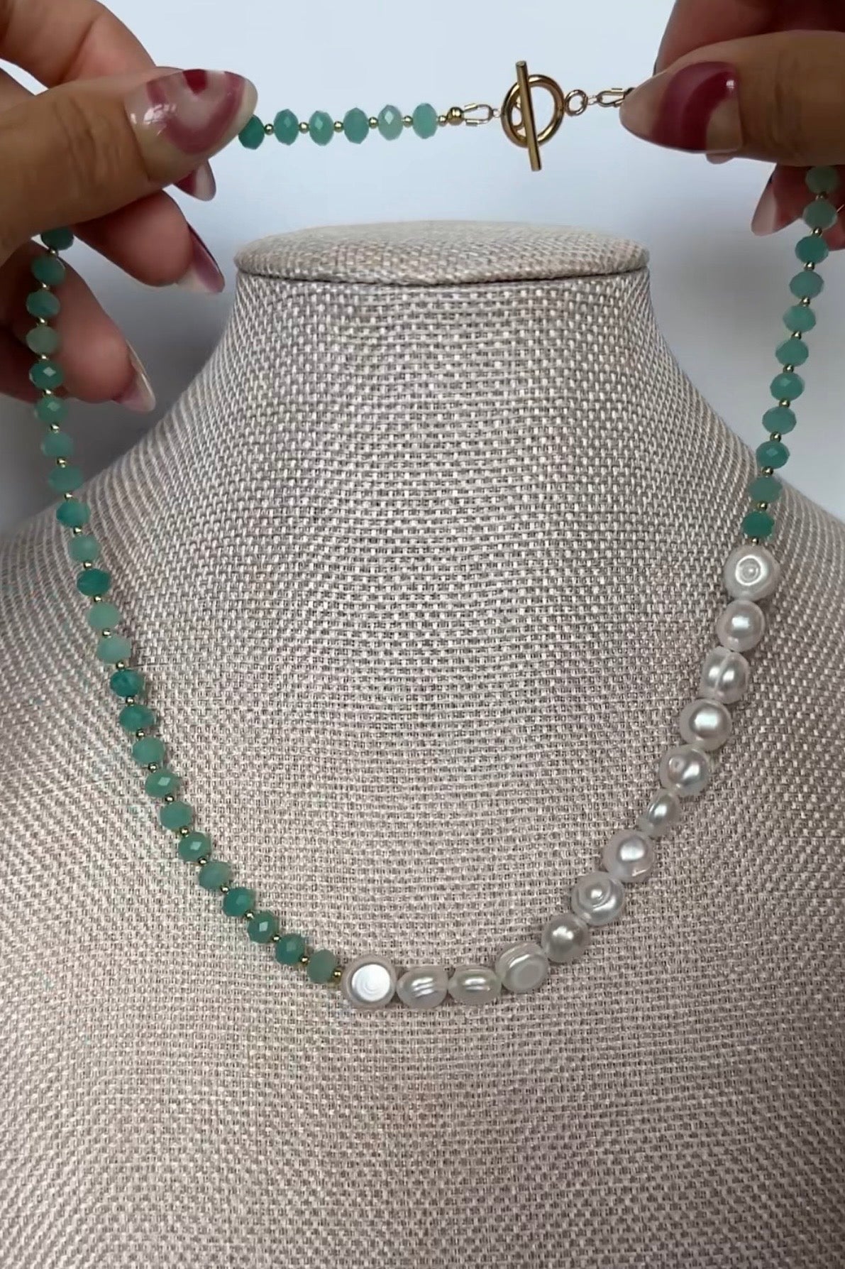 Auréad Designs Lake necklace product video — handmade amazonite and freshwater pearl necklace from the Glacier Collection, showing full piece, asymmetric design detail, and worn styling